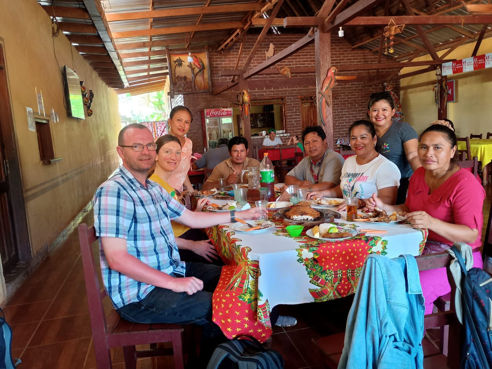 Liberation team sharing a meal with co-operative partners in Bolivia